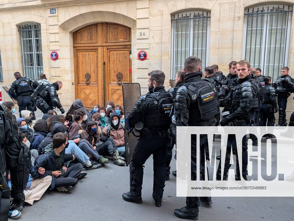 Students stage sit-in protest at Sciences Po Paris PARIS, FRANCE - OCTOBER 22: French gendarmerie officers stand in front of students staging a sit-in protest outside Sciences Po Paris in Paris, France, on October 22, 2026. Students remain seated on the ground near the institution s entrance as officers holding riot shields monitor the demonstration. Luc Auffret Anadolu Paris France. Editorial use only. Please get in touch for any other usage.