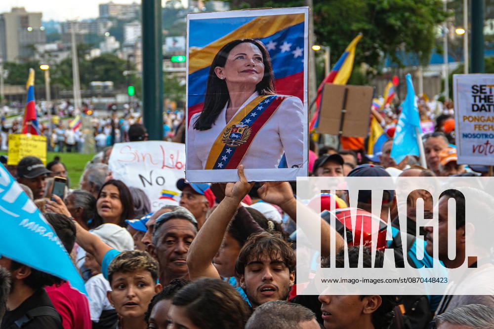 Venezuelan opposition supporters rally for free elections in Caracas CARACAS, VENEZUELA - OCTOBER 22: Members of political organizations such as Vente Venezuela, Primero Justicia, and Voluntad Popular gather in the surroundings of Plaza Venezuela in response to the call made by Venezuelan opposition leader and pro-democracy activist Maria Corina Machado, featuring speeches from various political and social leaders focused on memory, respect, democracy, and the demand for free elections in Caracas, Venezuela on October 22, 2026. Diko Betancourt Anadolu Caracas Venezuela. Editorial use only. Please get in touch for any other usage.