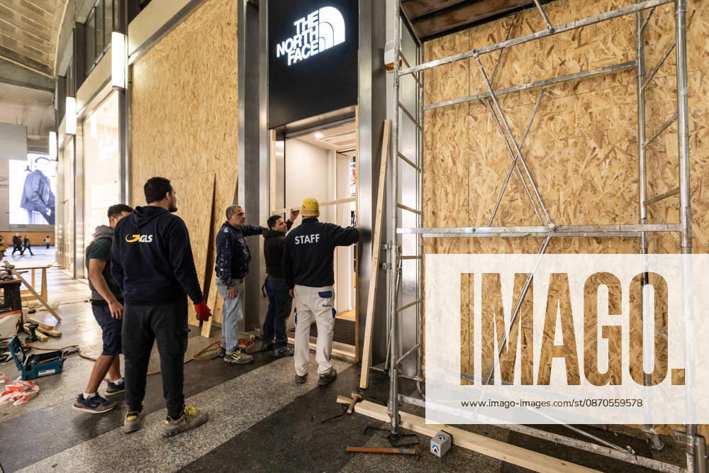 Shops in Milan board up windows ahead of cost-of-living protest MILAN, ITALY - OCTOBER 23: On the eve of an unauthorized demonstration against the high cost of living, some shop windows are being covered with wooden panels for protection in Milan, Italy, on October 23, 2026. This measure follows the destruction and looting that took place in Milan the previous weekend during similar protests against the high cost of living. Andrea Carrubba Anadolu Milan Italy. Editorial use only. Please get in touch for any other usage.