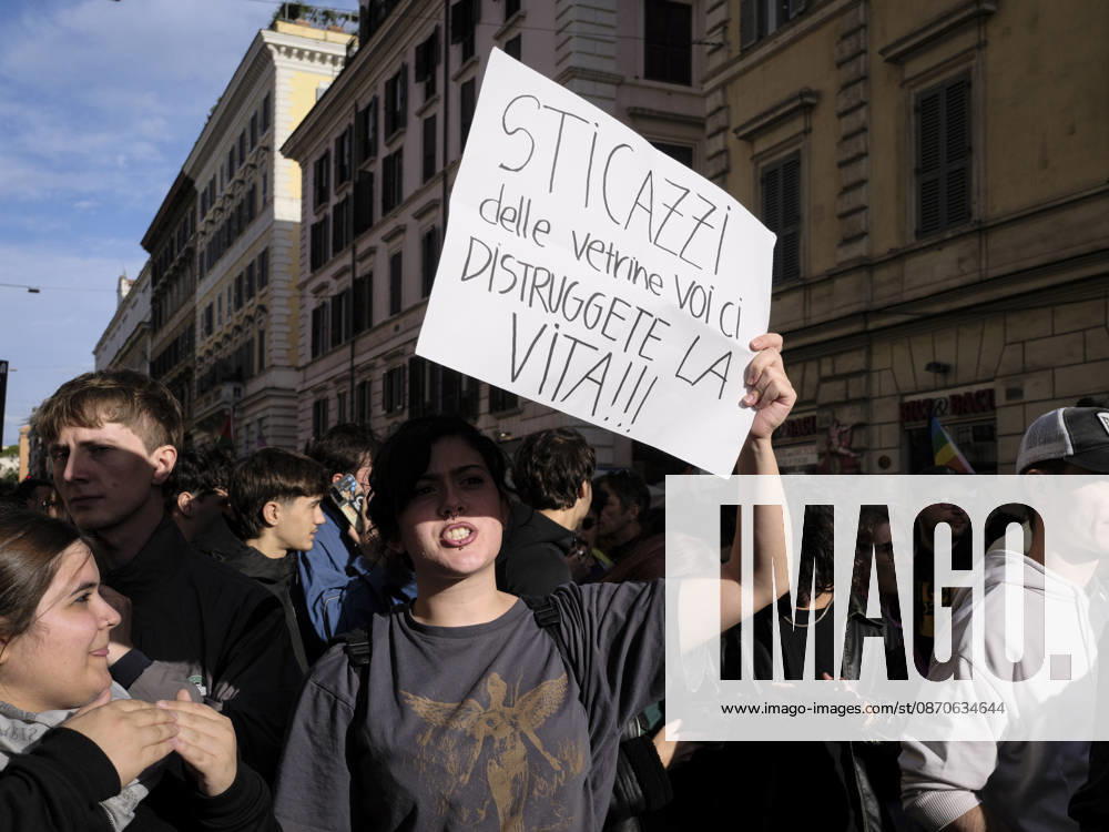 Rome Anti War Protest A demonstrator holds a sign reading Who cares about shop windows, you re destroying our lives! during an anti-war protest in Rome, Italy on October 24, 2026. Demonstrators took part in an anti-war march under the slogan Keep Italy Out of the War . Protesters further voiced opposition to Italy s involvement in armed conflicts, military rearmament and government policies. Rome Lazio Italy