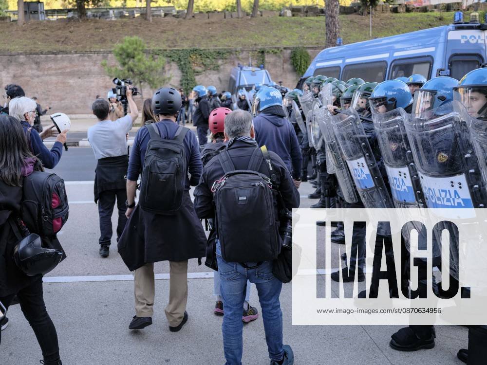 Rome Anti War Protest Police officers stand guard near demonstrators in Rome, Italy on October 24, 2026. Demonstrators took part in an anti-war march under the slogan Keep Italy Out of the War . Protesters further voiced opposition to Italy s involvement in armed conflicts, military rearmament and government policies. Rome Lazio Italy