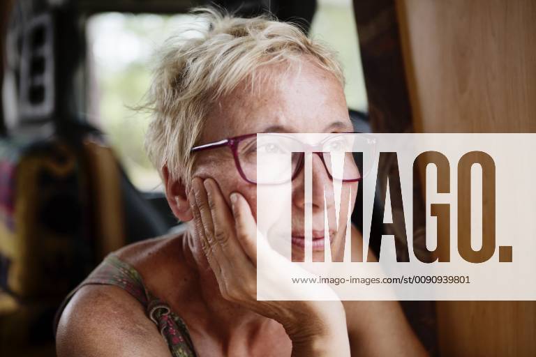 France, portrait of pensive woman in camper model released Symbolfoto property released JATF01128
