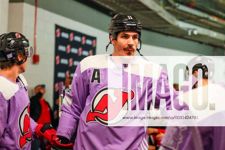 New Jersey Devils center Brian Boyle (11) warms up before of an NHL hockey  game against the New York Islanders Friday, Nov. 23, 2018, in Newark, N.J.  The Devils wore purple warm-up