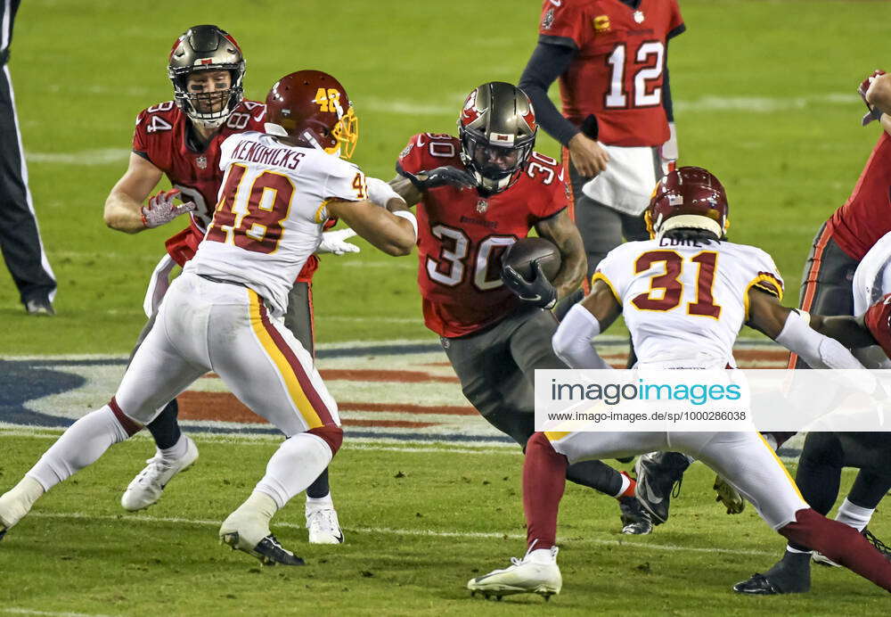 Ke'Shawn Vaughn of the Tampa Bay Buccaneers rushes the ball