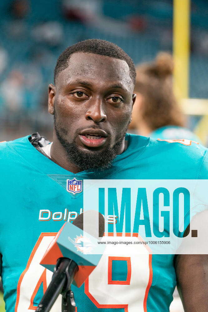 Miami Dolphins linebacker Sam Eguavoen (49) and Miami Dolphins