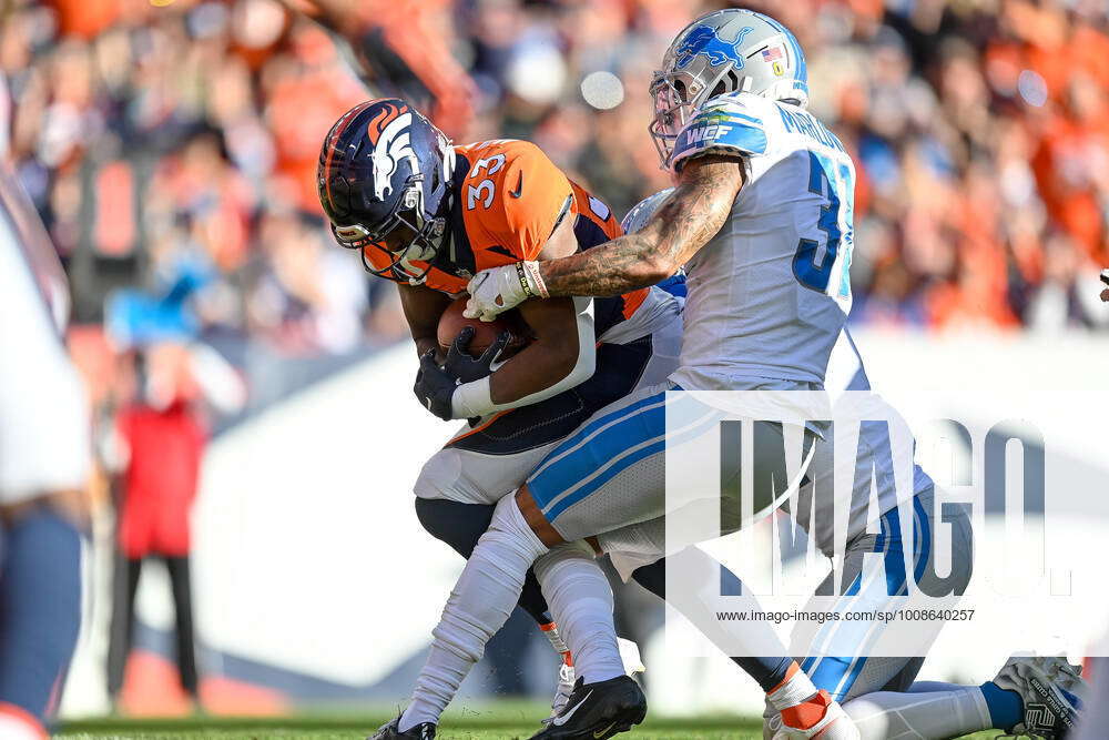 Denver Broncos running back Javonte Williams (33) runs against the