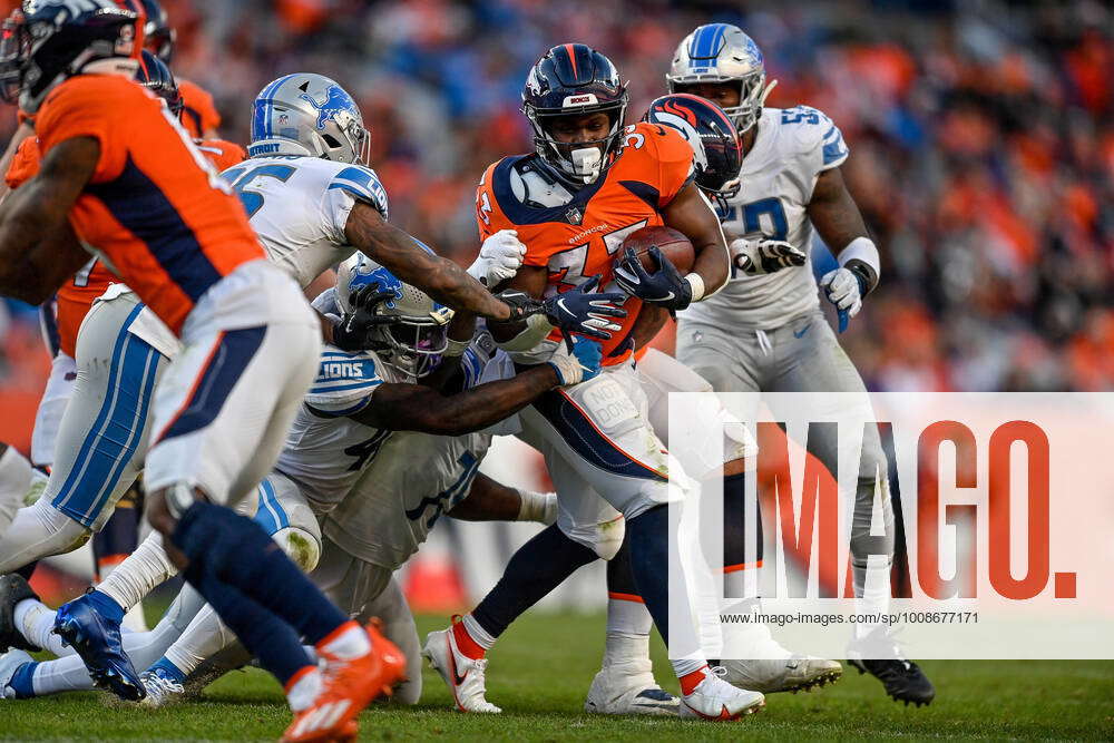 DENVER, CO - NOVEMBER 14: Denver Broncos running back Javonte Williams (33)  rushes during a game between the Denver Broncos and the Philadelphia Eagles  at Empower Field at Mile High on November