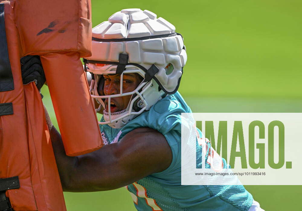 Miami Dolphins linebacker Channing Tindall runs a drill during the