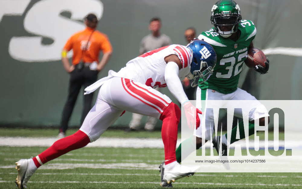 New York Jets running back Michael Carter (32) warms up before taking on  the Miami Dolphins during an NFL football game Sunday, Oct. 9, 2022, in  East Rutherford, N.J. (AP Photo/Adam Hunger