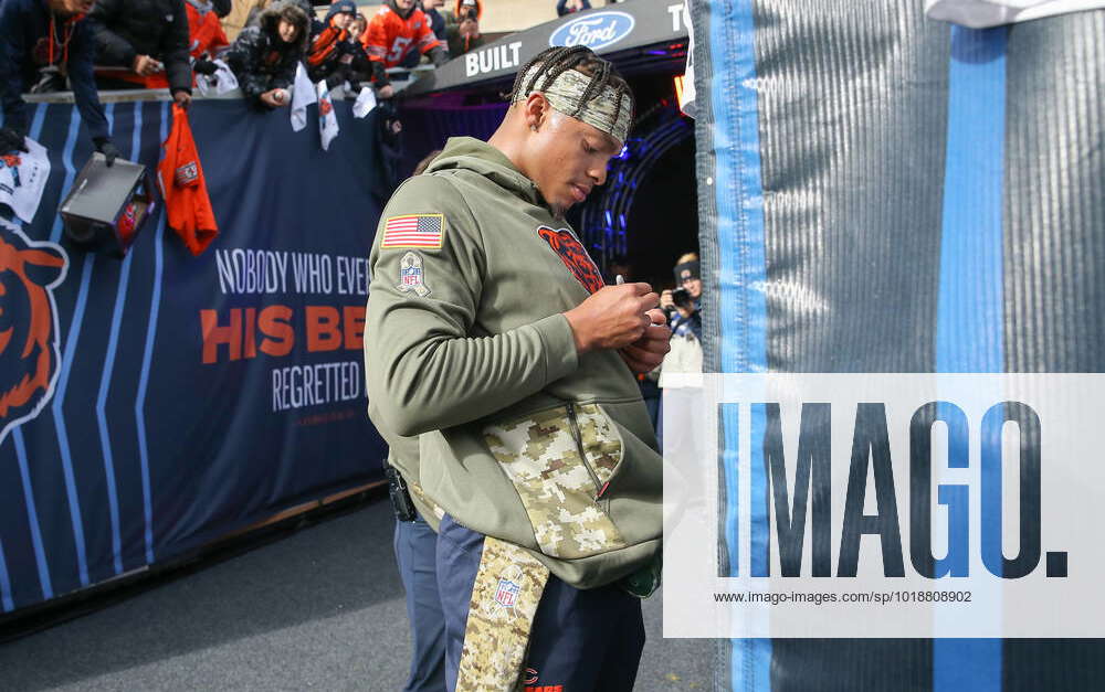 CHICAGO, IL - NOVEMBER 13: Chicago Bears quarterback Justin Fields (1)  signs autographs before a game between the Detroit Lions and the Chicago  Bears on November 13, 2022 at Soldier Field in