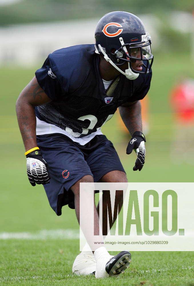 Chicago Bears cornerback Nathan Vasher is doused with water to keep cool on  the first day of practice for the Bears during their NFL football training  camp Thursday, July 27, 2006, in