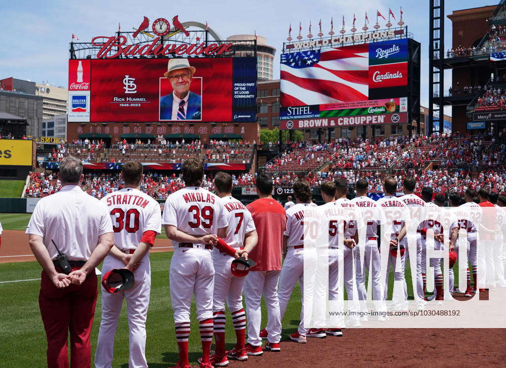 members of the St. Louis Cardinals stand for the National Anthem