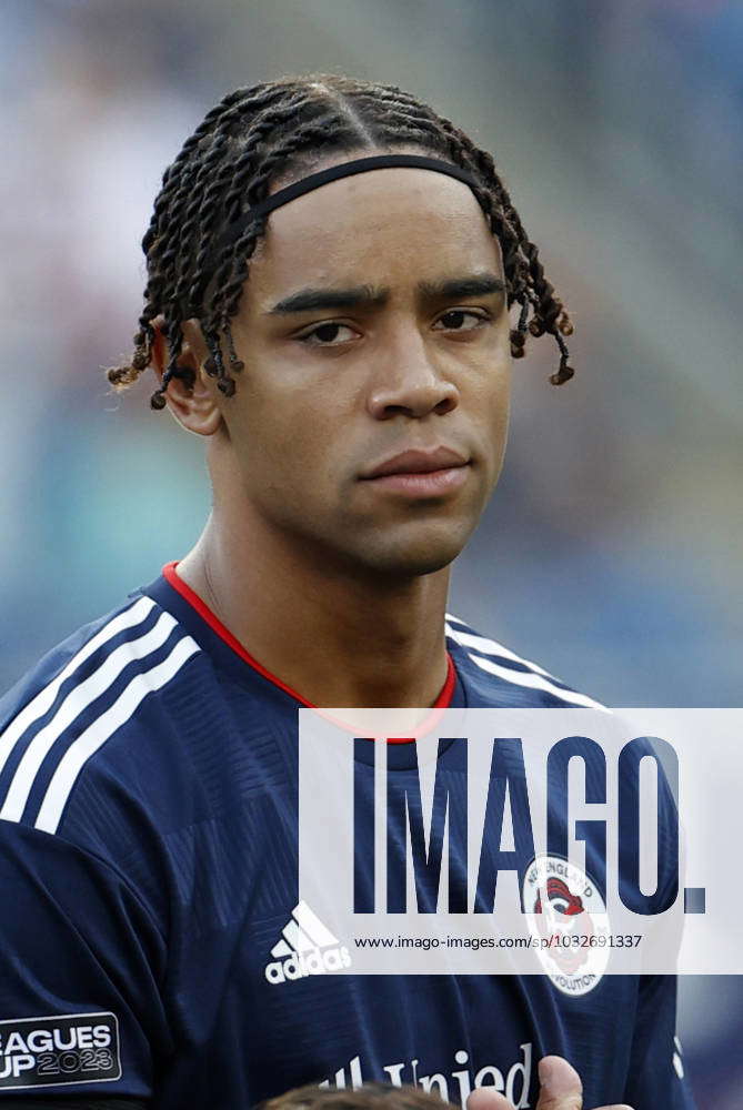 FOXBOROUGH, MA - APRIL 22: New England Revolution defender Brandon Bye (15)  lays the ball off during a match between the New England Revolution and  Sporting Kansas City on April 22, 2023