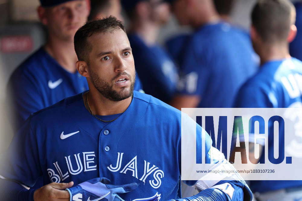 George Springer of the Toronto Blue Jays walks into the dugout