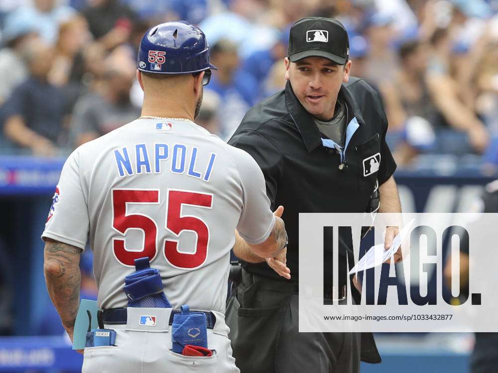 Home plate umpire Nate Tomlison greets Chicago Cubs first base coach Mike  Napoli (55) before a