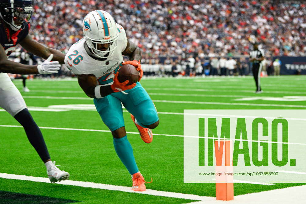 Salvon Ahmed of the Miami Dolphins rushes against the Houston