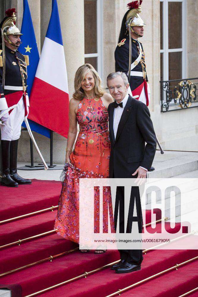 LVMH CEO Bernard Arnault and his wife Helene upon arrival to the cocktail  reception for the inauguration of the new Louis Vuitton house on the  Champs-Elysees in Paris, France, on October 9