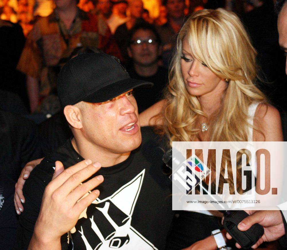 Porn Star JENNA JAMESON sits on the lap of UFC boxer TITO ORTIZ at the  Ultimate