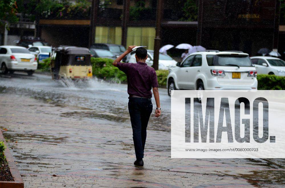 Sri Lanka: Colombo hit by heavy rain, floods A man walks during a heavy ...