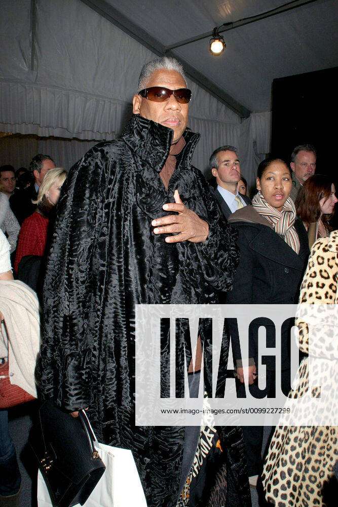 Andre Leon Talley (carrying a Louis Vuitton attache case) at fashion show  for Michael Kors Fall