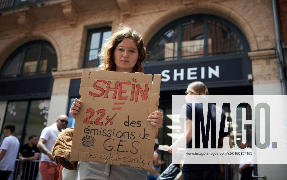 XR Activists Protest Against A SHEIN Popup Store A young woman holds a
