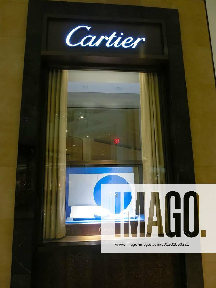 Sign with Cartier logo at shopwindow of Cartier store in Aventura