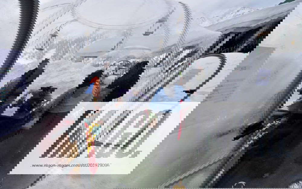 India First Glass Igloo restaurant in Gulmarg, Kashmir people enjoying