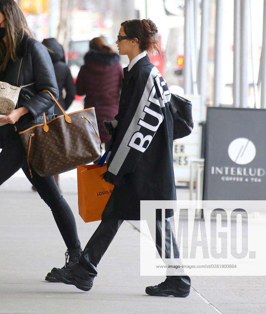 bella hadid carries her louis vuitton and chanel bags as she steps out of  her apartment in new york city-021120_4